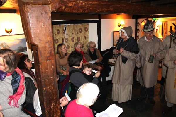Some of the Minns family enjoy watching the play in the Chequers Inn.
