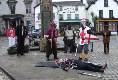 Betty Askett berates Saint George for killing her son, the Prince of Paradise